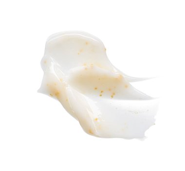 Beyaz arka planda sarı bezelye ile beyaz yüz kremi smear ve doku