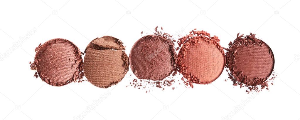 Broken texture of eyeshadows in trendy shades isolated on white background