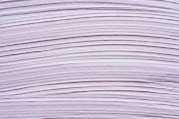 Gently purple texture and strokes of a facial cleansing mask or acrylic paint isolated on a white background