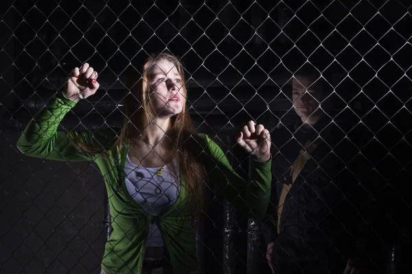 Girl behind bars — Stock Photo, Image