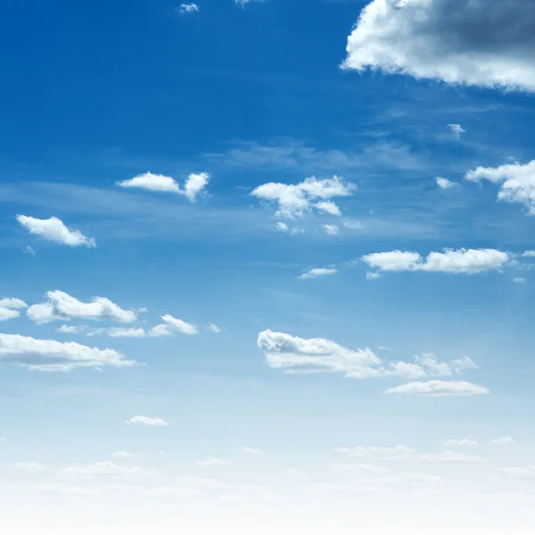 Blue sky and clouds. Summer air background