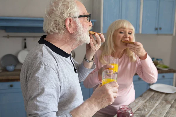 Senior couple having breakfast. — Stock Photo, Image