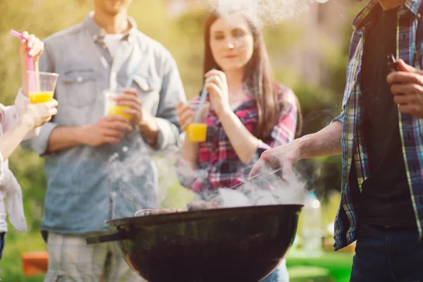 Meat frying on grill outdoors. — Stock Photo, Image