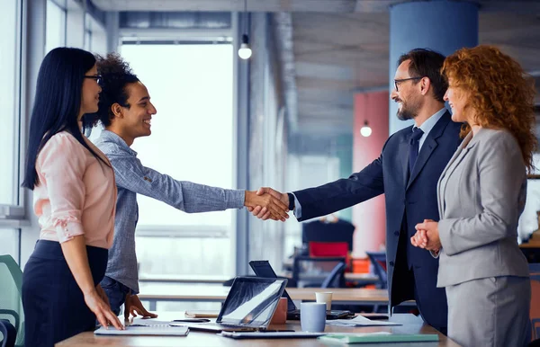 Multiethnic business teams at meeting room shaking hands. — Stock Photo, Image