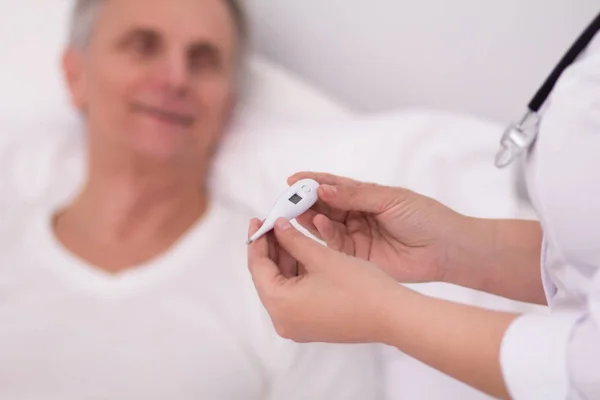 Nurse with thermometer. — Stock Photo, Image