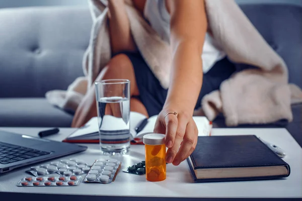 Close-up look of female hand reaching for pills — Stock Photo, Image