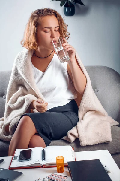 Sick woman takes her medication — Stock Photo, Image