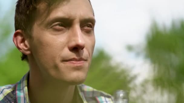 Close-up portrait of thoughtful man. BBQ party — Stock Video