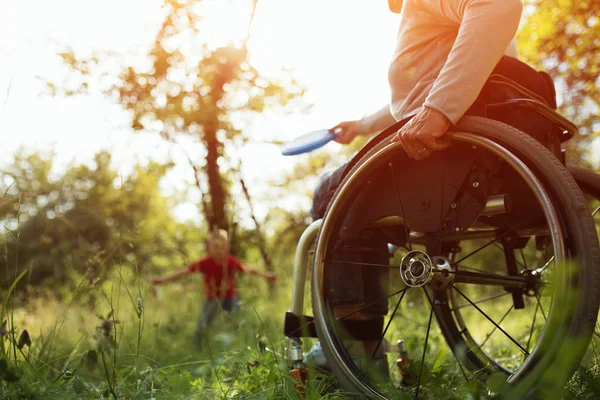 Close-up view on the wheels of a wheelchair. Bright — Stock Photo, Image