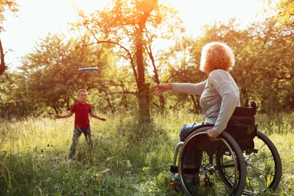 Close-up view on the wheels of a wheelchair. Bright — Stock Photo, Image