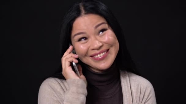 Beautiful woman shows different emotion while speaking phone — Stock Video