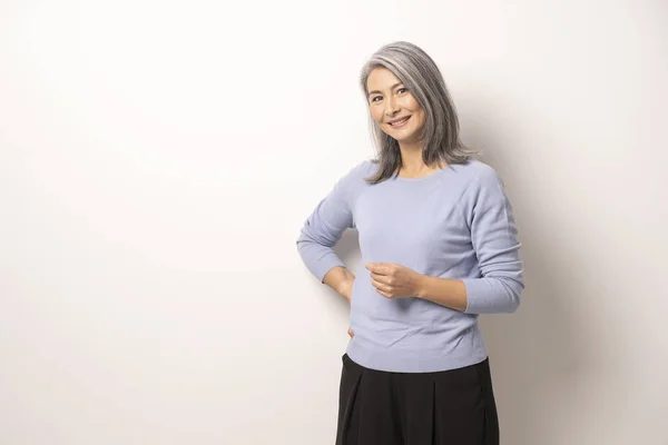 Mongolian beautiful Gray Haired Woman on a White Background. — Stock Photo, Image