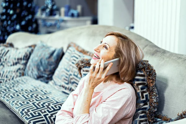 Beautiful mature woman takes selfie at home — Stock Photo, Image