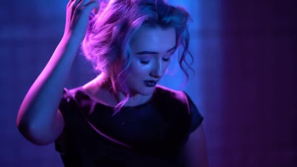 Young Blond Model is Posing in Neon — Stock Video