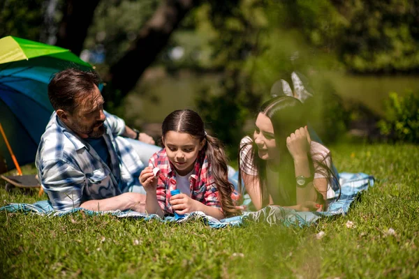 Happy family enjoying time in summer park — Stock Photo, Image