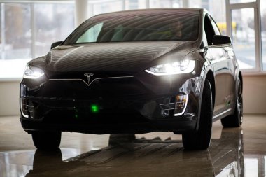 Tesla New-generation Electric Car of Dark Brown Indoor clipart