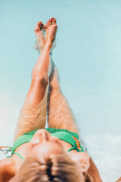 Look from the top of a blonde in green bikini — Stock Photo, Image