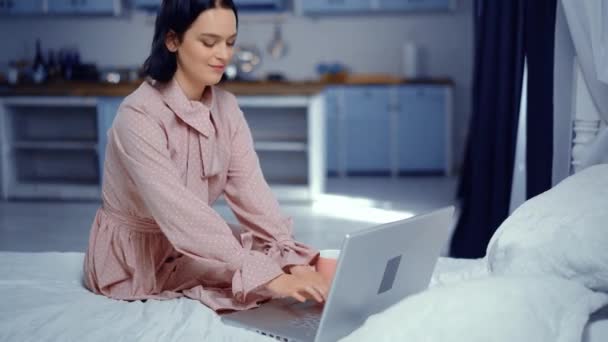 Young brunette woman spending time in room — 비디오