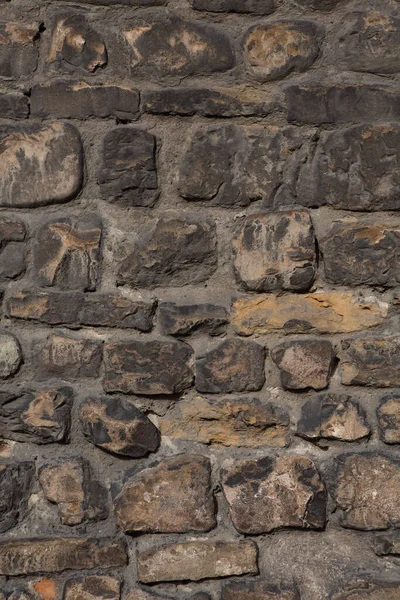 Antigua pared de piedra de ladrillo textura o fondo. pared antigua con ladrillo marrón hecho a mano. Primer plano. — Foto de Stock