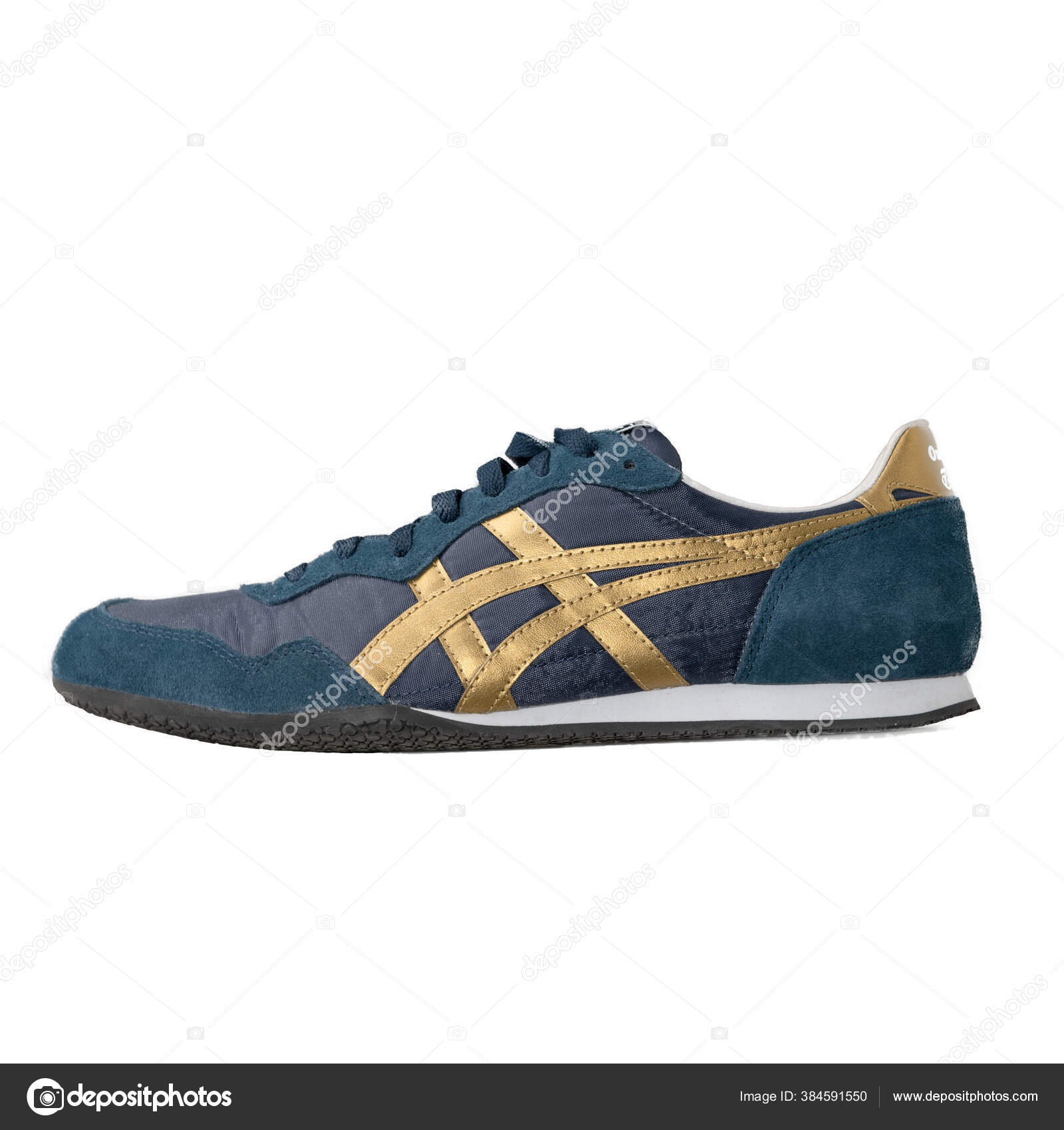 white sneakers with gold accents