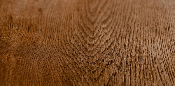 Textura de madeira. Madeira de cor marrom tratada, padrão abstrato ou fundo. Um tiro de perto. Imagem macro — Fotografia de Stock