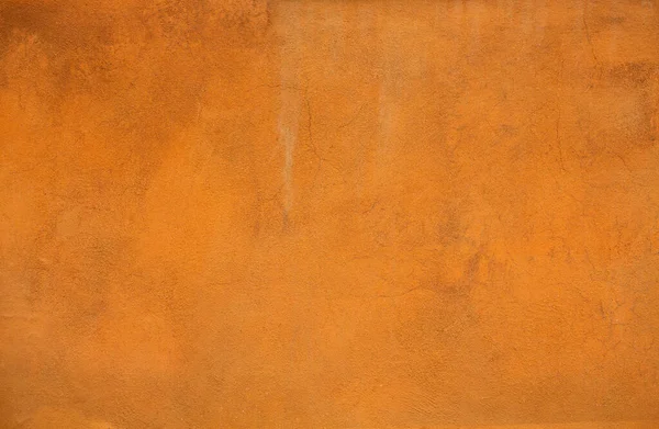 오렌지 색의 stucco 배경 또는 텍스처. 건물 의벽을 밝게칠 한 밝은 조명 — 스톡 사진