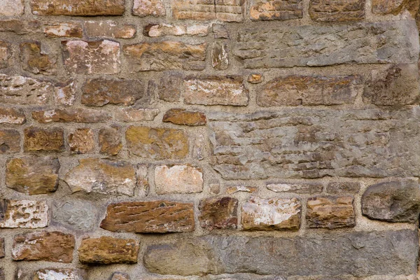 Грандиозная кирпичная каменная стена светло-бежевого цвета. Абстрактная текстура или фон — стоковое фото