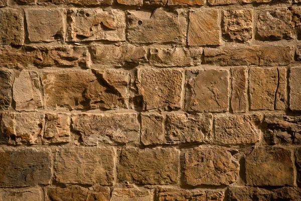 Antique brick wall in sunligh. Cracked and scratched on brown masonry or brickwork. Close up shot. Abstract background or texture — Stock Photo, Image