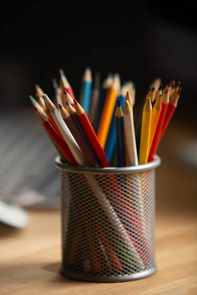 Office workplace concept. Color pencils at wooden office desk. Close up shot — Stock Photo, Image