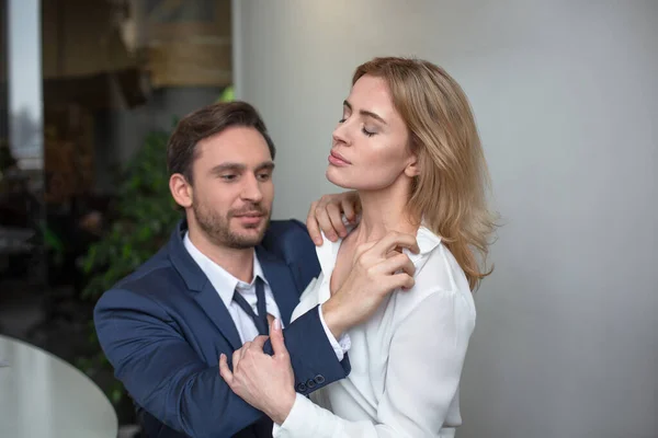 Workplace romance. Two business people passion flirting at job. Erotic couple sitting together at office desk. Sexual enjoyment concept — Stock Photo, Image