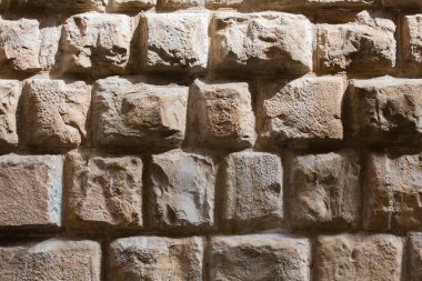 Old brick wall in sunligh. Grunge brown masonry or brickwork. Close up shot. Abstract background or texture clipart