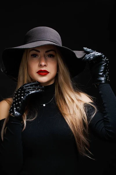 Photo of young blonde in hat , gloves — Stock Photo, Image