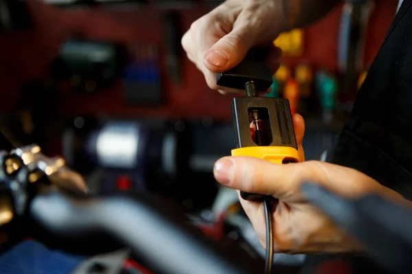 Photo of master hand with appliance in workshop — Stock Photo, Image