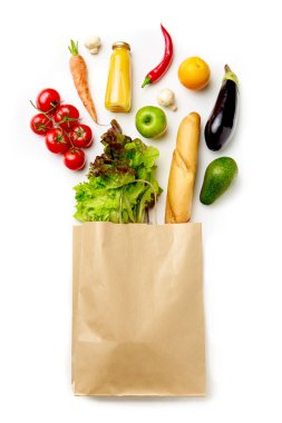 Photo of paper bag with vegetables, juice, orange