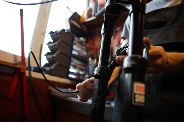 Picture of man holding bicycle repair — Stock Photo, Image