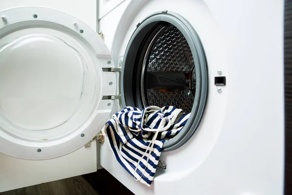 Image of open washing machine with striped cloth — Stock Photo, Image