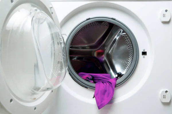 Image of open washing machine with violet cloth — Stock Photo, Image