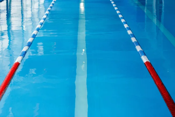 Image from top of swimming pool with blue and white, red dividers — Stock Photo, Image
