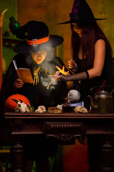 Image of witches with pot of magical potion — Stock Photo, Image