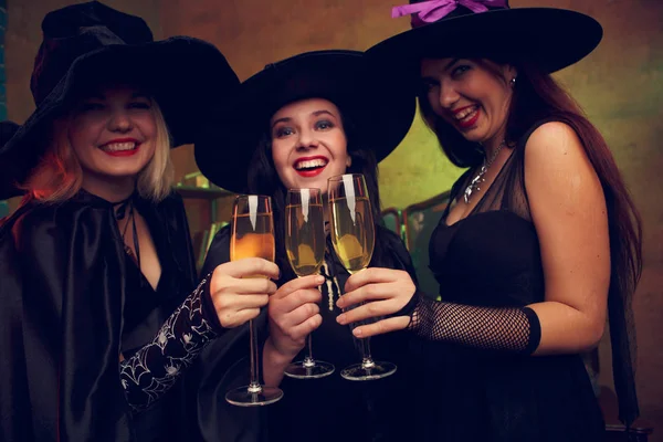 Photo of three young witches with glass of champagne — Stock Photo, Image