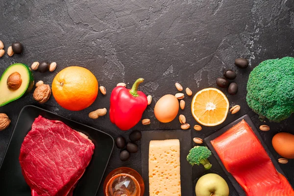 Image of food products on stone table . Empty space on top for text.