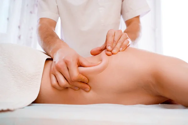 Photo of hands of massage therapist making massage to man. — Stock Photo, Image