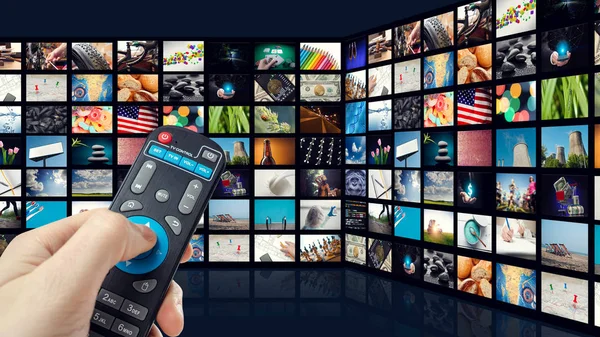 TV screen with lot of pictures and hands of man with remote control on blue background — Stock Photo, Image