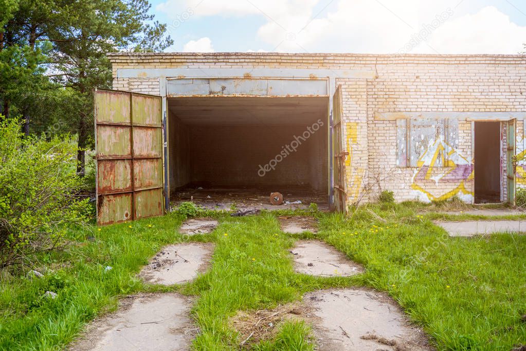Photo of brick garage with open doors