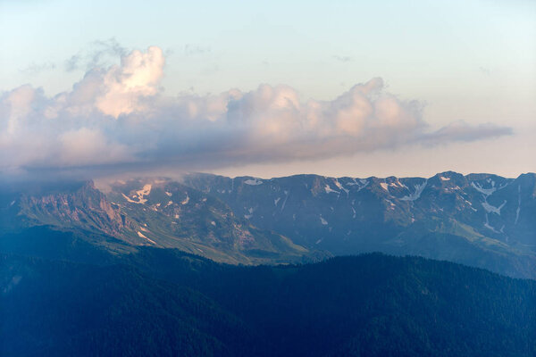 Russia, Sochi - July 4, 2019: Photo of picturesque mountain area, fog, cloudy sky .