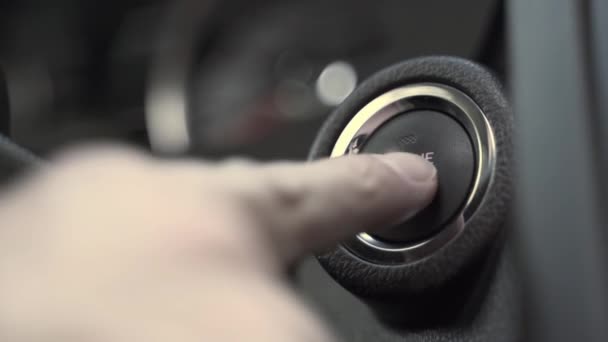 Man presses internal combustion engine start button closeup — Stock Video