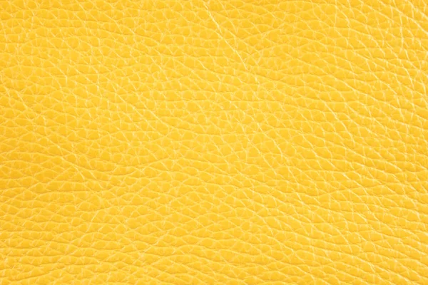 Sfondo con pelle artificiale giallo sole, primo piano - ph — Foto Stock