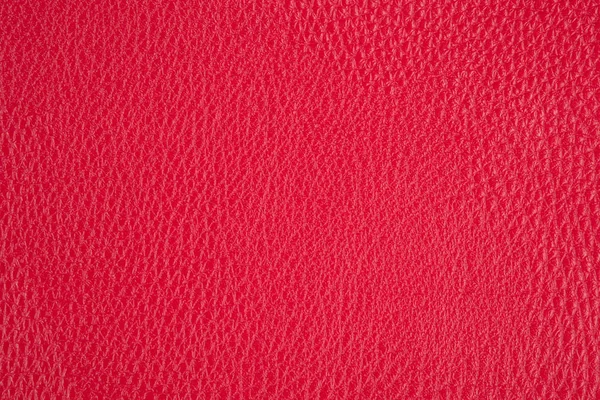 Sfondo con pelle artificiale rossa, primo piano - immagine fotografica Immagine Stock