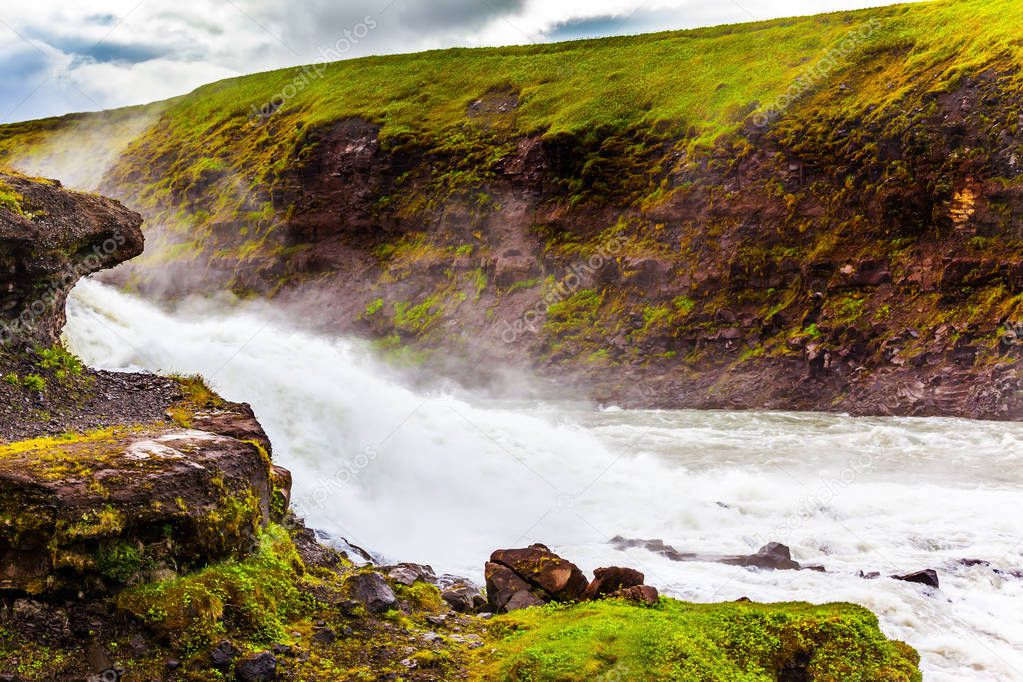 Huge masses of Gullfoss waterfall crashing into abyss, Iceland.