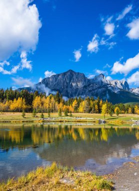 Clouds are reflected in the water clipart